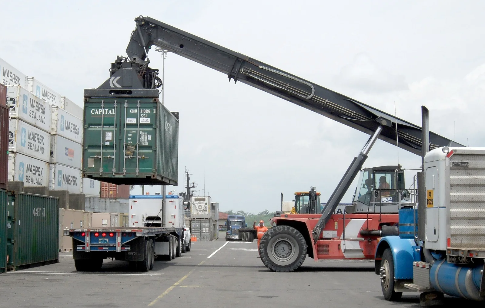 Shipping container being handled at a terminal